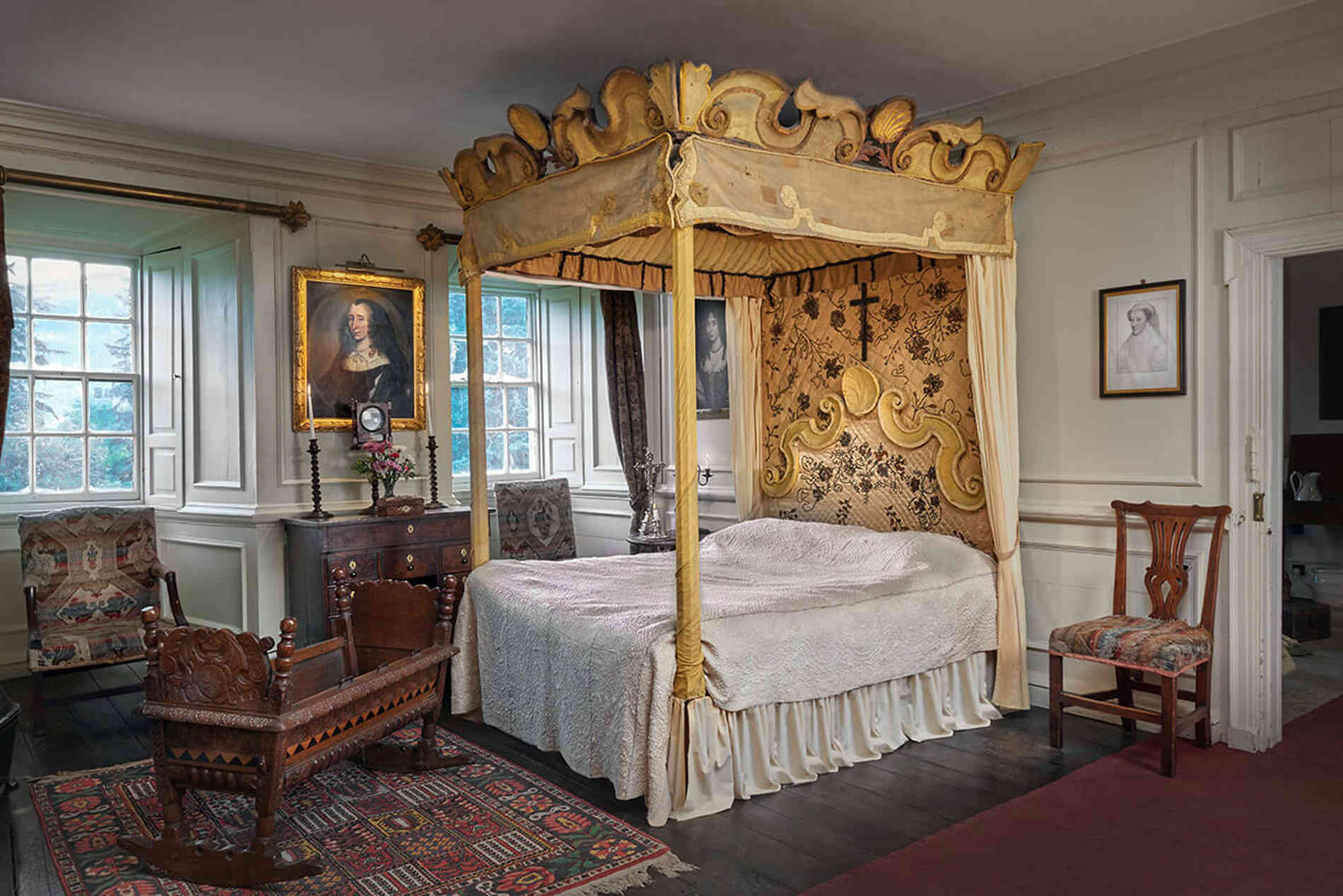 The bed where Mary Queen of Scots slept in 1566 and the crib used by James, her baby son